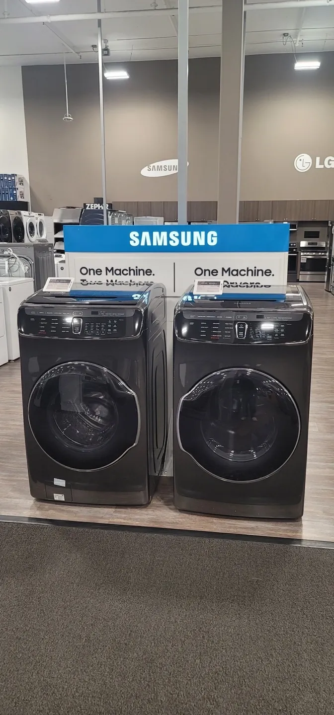 two black washing machines a few inches apart