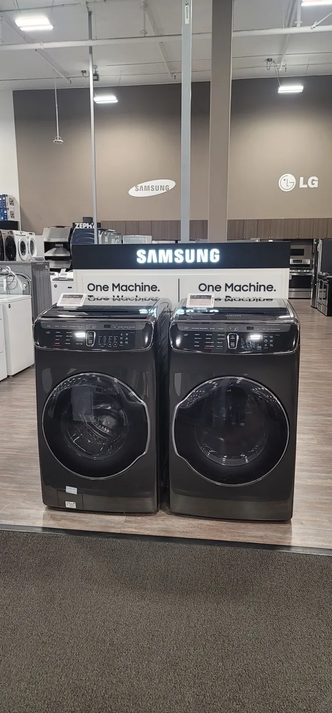 two black washing machines close to together